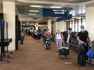 Visitors at Daniel K. Inouye International Airport on the first day of the Hawaii Safe Travel program in October.